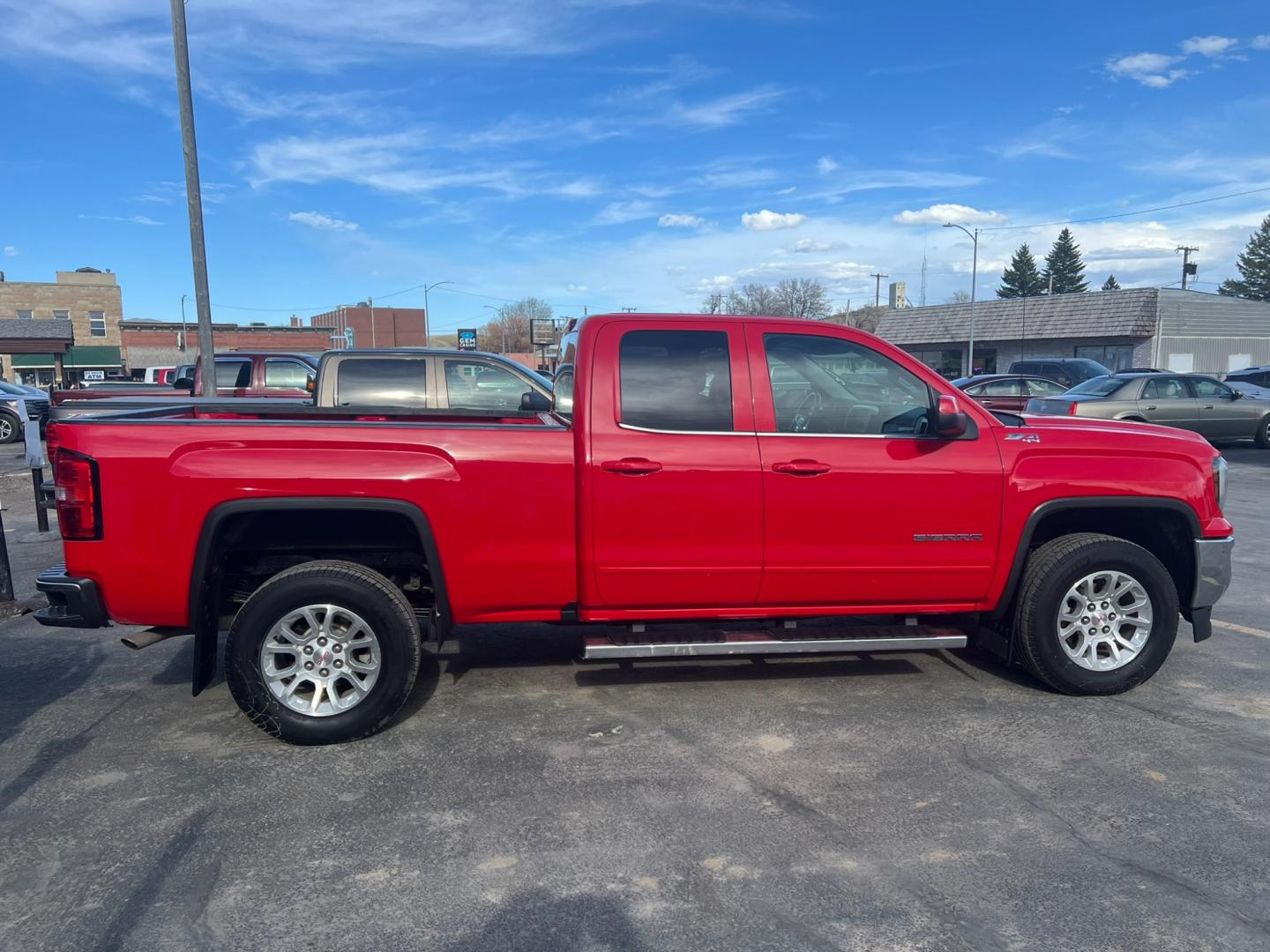 2019 Red /Charcoal GMC Sierra 1500 SLE (2GTV2MEC9K1) with an 5.3L V8 engine, Automatic transmission, located at 116 5th Avenue South, Lewistown, MT, 59457, 47.063877, -109.427879 - Discover the rugged versatility of the 2019 GMC Sierra 1500 SLE Double Cab 4WD. This truck is built to handle tough tasks with ease, whether you're tackling a worksite or heading off-road for adventure. Equipped with a powerful 5.3L V8 engine and advanced 4WD system, the Sierra 1500 SLE delivers im - Photo#1